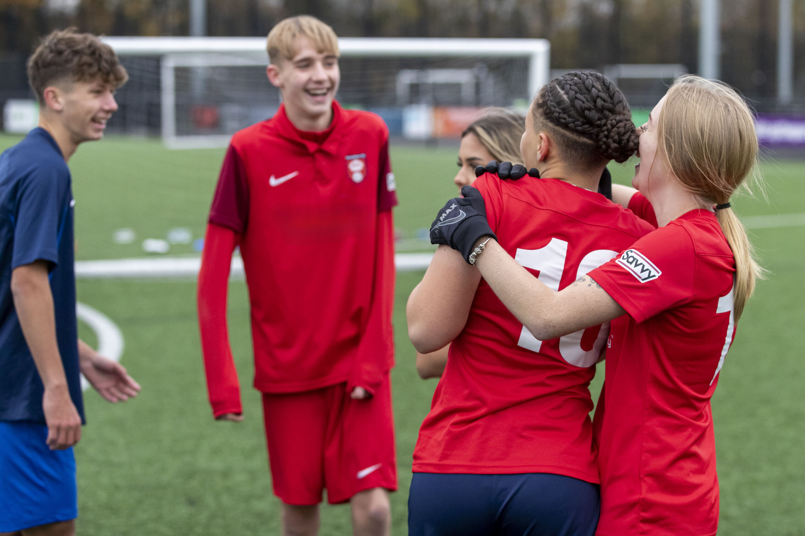 Hampshire FA Academy players smiling on the field during training