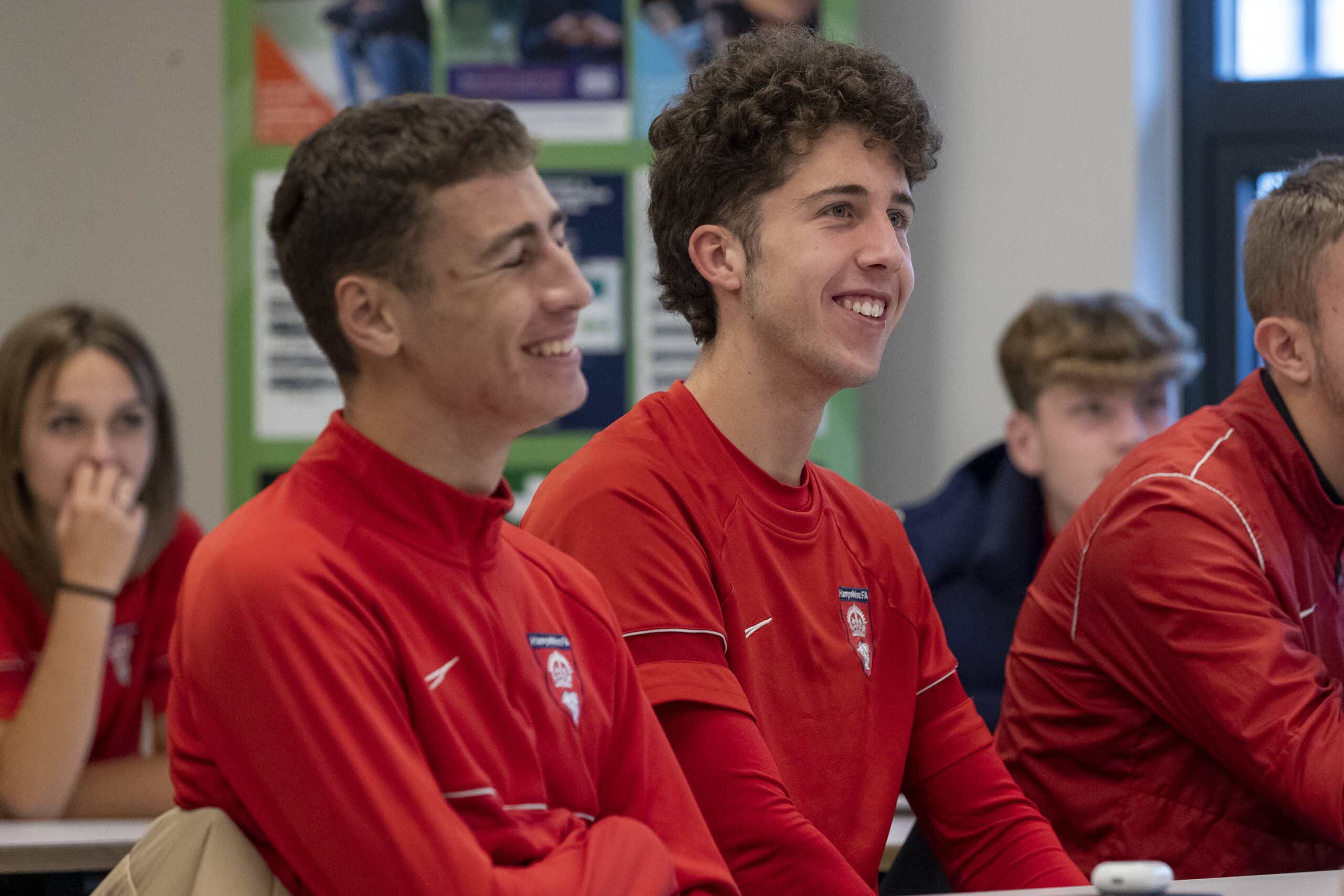 Hampshire FA Academy players smiling in a lesson