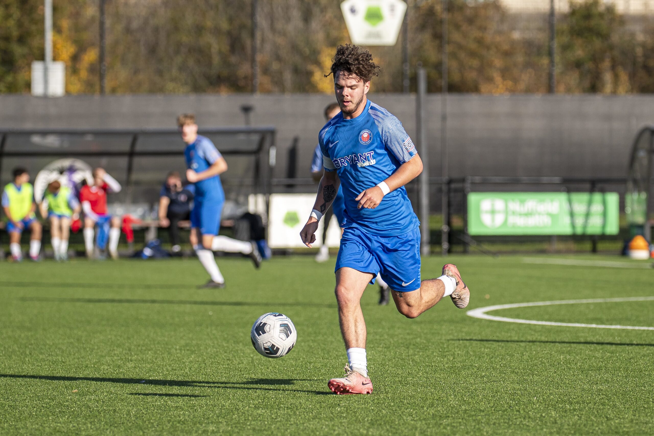 Hampshire FA Academy player running with the ball.