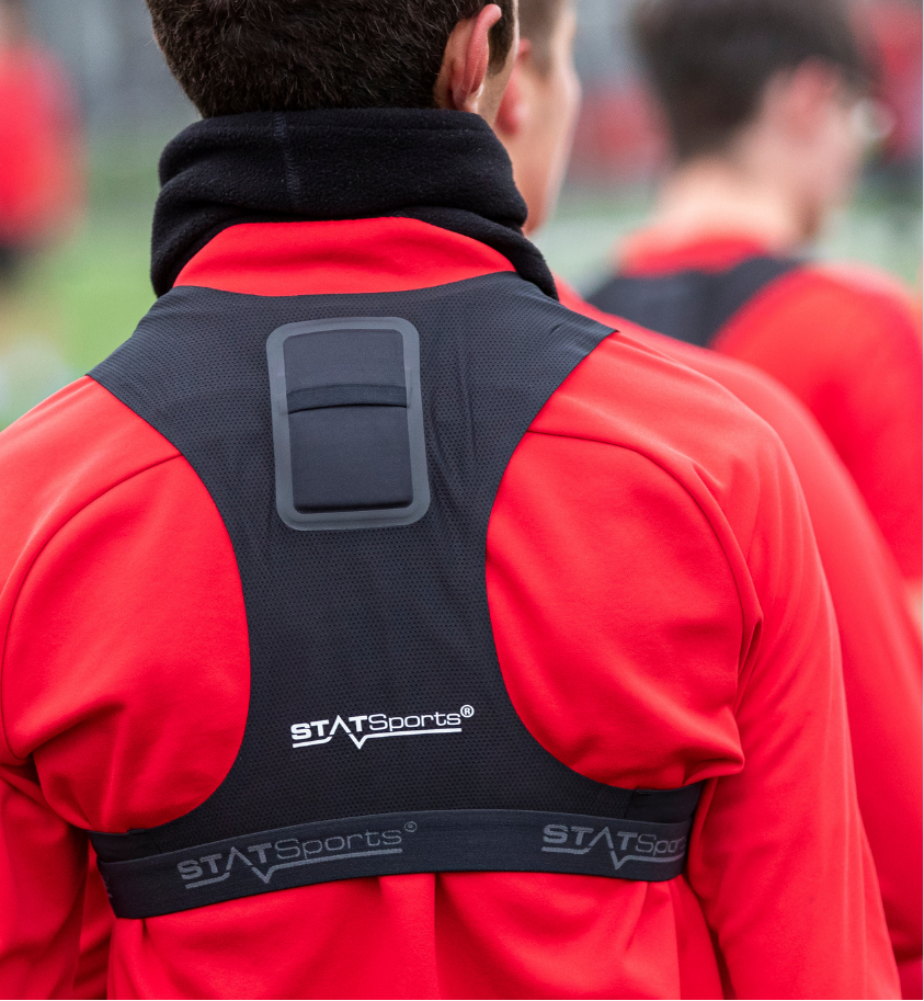 Photo of the back of a Hampshire FA Academy students wearing a STATSports tracker vest.