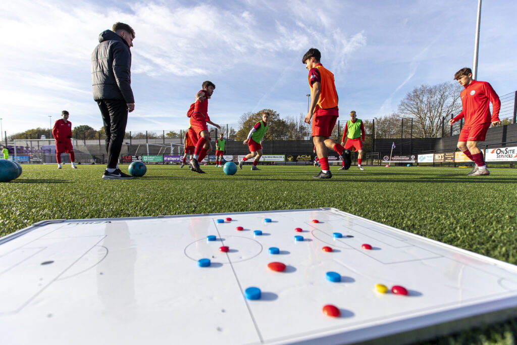 Photo of football board and players
